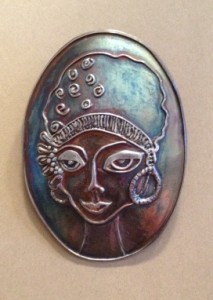 Fired and finished metal clay portrait with patina.